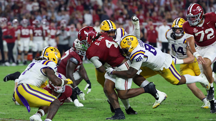Nov 8, 2025; Tuscaloosa, Alabama, USA; Louisiana State Tigers defensive lineman Bernard Gooden (88) tackles Alabama Crimson Tide running back Daniel Hill (4) during the fourth quarter of the game at Saban Field at Bryant-Denny Stadium. Mandatory Credit: David Leong-Imagn Images