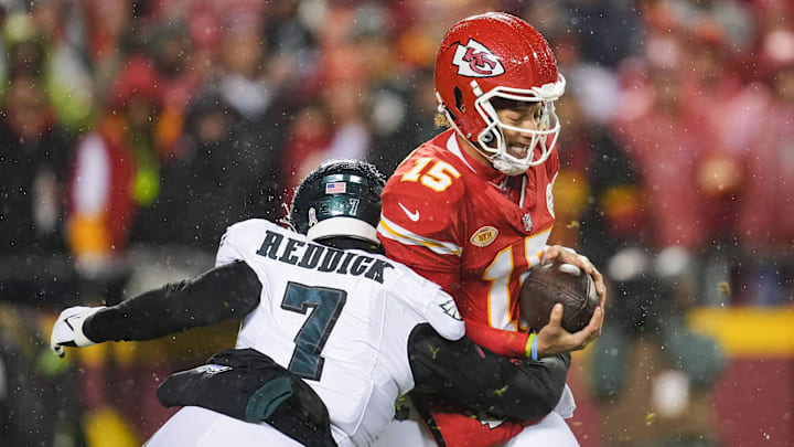 Nov 20, 2023; Kansas City, MO; Kansas City Chiefs quarterback Patrick Mahomes (15) is sacked by Philadelphia Eagles linebacker Haason Reddick (7) during the first half at GEHA Field at Arrowhead Stadium. 