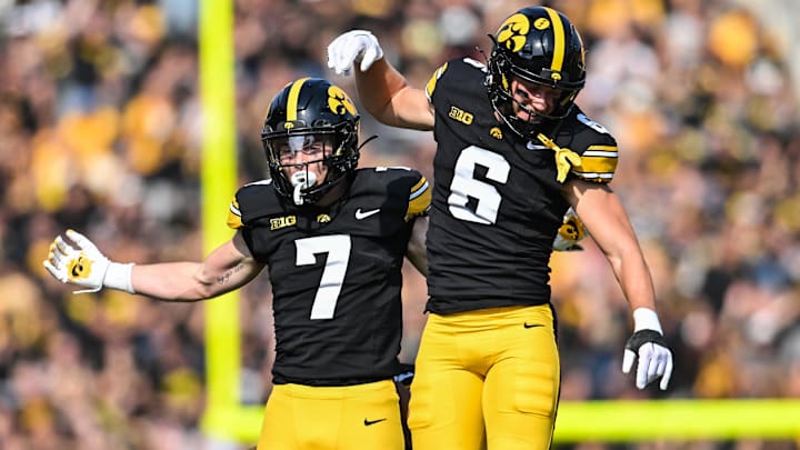 Oct 12, 2024; Iowa City, Iowa, USA; Iowa Hawkeyes defensive back John Nestor (7) and defensive back Zach Lutmer (6) react during the fourth quarter against the Washington Huskies at Kinnick Stadium. Mandatory Credit: Jeffrey Becker-Imagn Images