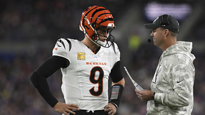 Nov 7, 2024; Baltimore, Maryland, USA; Cincinnati Bengals quarterback Joe Burrow (9) speaks with Cincinnati Bengals head coach Zac Taylor during the first quarter  against the Baltimore Ravens at M&T Bank Stadium. Mandatory Credit: Tommy Gilligan-Imagn Images