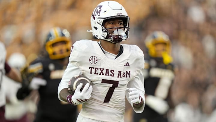 Nov 8, 2025; Columbia, Missouri, USA; Texas A&M Aggies wide receiver KC Concepcion (7) runs for a touchdown during the second half against the Missouri Tigers at Faurot Field at Memorial Stadium. Mandatory Credit: Jay Biggerstaff-Imagn Images]