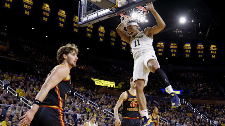 Jan 2, 2026; Ann Arbor, Michigan, USA;  Michigan Wolverines guard Roddy Gayle Jr. (11) dunks on Southern California Trojans forward Jaden Brownell (33) in the first half at Crisler Center. Mandatory Credit: Rick Osentoski-Imagn Images