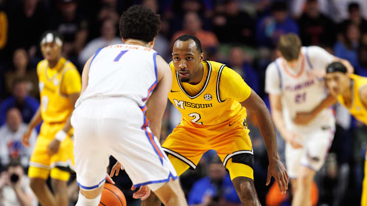 Jan 14, 2025; Gainesville, Florida, USA; Missouri Tigers guard Tamar Bates (2) defends Florida Gators guard Walter Clayton Jr. (1) during the first half at the Stephen C. O'Connell Center in Gainesville, FL on Tuesday, January 14, 2025. Mandatory Credit: Matt Pendleton-Imagn Images Jan 14, 2025; Gainesville, Florida, USA; Missouri Tigers guard Tamar Bates (2) defends Florida Gators guard Walter Clayton Jr. (1) during the first half at the Stephen C. O'Connell Center in Gainesville, FL on Tuesday, January 14, 2025. Mandatory Credit: Matt Pendleton-Imagn Images
