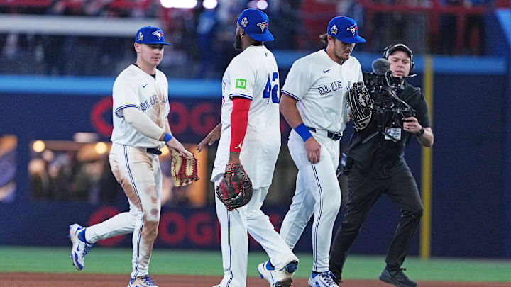 Apr 15, 2025; Toronto, Ontario, CAN; Toronto Blue Jays left fielder Alan Roden (18) celebrates the win with first baseman Vladimir Guerrero Jr. (27) against the Atlanta Braves at the end of the ninth inning at Rogers Centre. All players wore #42 for Jackie Robinson Day.