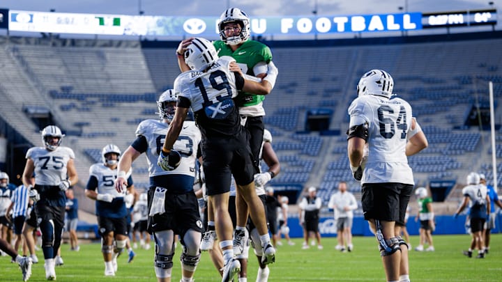 BYU quarterback Bear Bachmeier celebrates with brother Tiger Bachmeier at Fall Camp