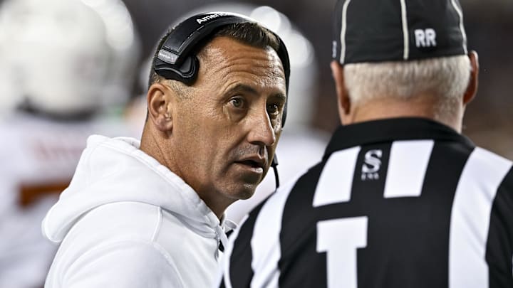 Texas Longhorns head coach Steve Sarkisian speaks with line judge.
