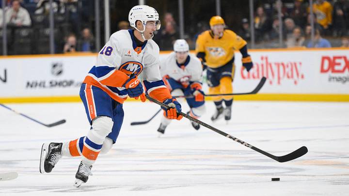 Apr 8, 2025; Nashville, Tennessee, USA; New York Islanders left wing Pierre Engvall (18) skates with the puck against the Nashville Predators  during the second period at Bridgestone Arena. Mandatory Credit: Steve Roberts-Imagn Images