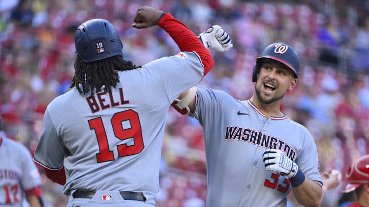 Jul 9, 2025; St. Louis, Missouri, USA;  Washington Nationals first baseman Nathaniel Lowe (33) celebrates with designated hitter Josh Bell (19) after hitting a three run home run against the St. Louis Cardinals during the first inning at Busch Stadium. 