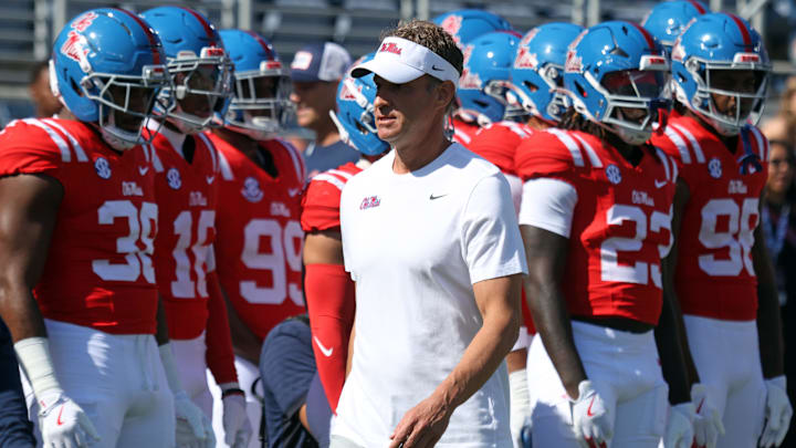 Oct 11, 2025; Oxford, Mississippi, USA; Mississippi Rebels head coach Lane Kiffin looks on during warm ups prior to the game against the Washington State Cougars at Vaught-Hemingway Stadium. Mandatory Credit: Petre Thomas-Imagn Images