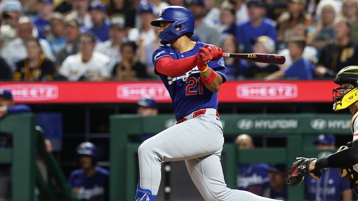 Jun 11, 2026; Pittsburgh, Pennsylvania, USA;  Los Angeles Dodgers pinch hitter Santiago Espinal (21) hits a single against the Pittsburgh Pirates during the seventh inning at PNC Park. Mandatory Credit: Charles LeClaire-Imagn Images