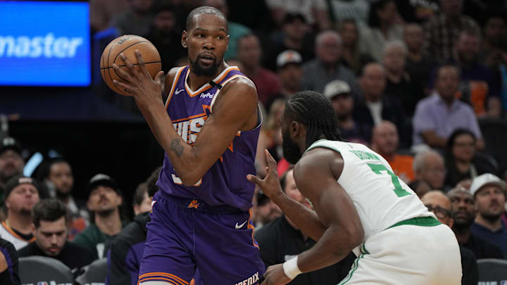 Mar 26, 2025; Phoenix, Arizona, USA; Phoenix Suns forward Kevin Durant (35) shields the ball from Boston Celtics guard Jaylen Brown (7) during the first half at Footprint Center. Mandatory Credit: Rick Scuteri-Imagn Images Mar 26, 2025; Phoenix, Arizona, USA; Phoenix Suns forward Kevin Durant (35) shields the ball from Boston Celtics guard Jaylen Brown (7) during the first half at Footprint Center. Mandatory Credit: Rick Scuteri-Imagn Images