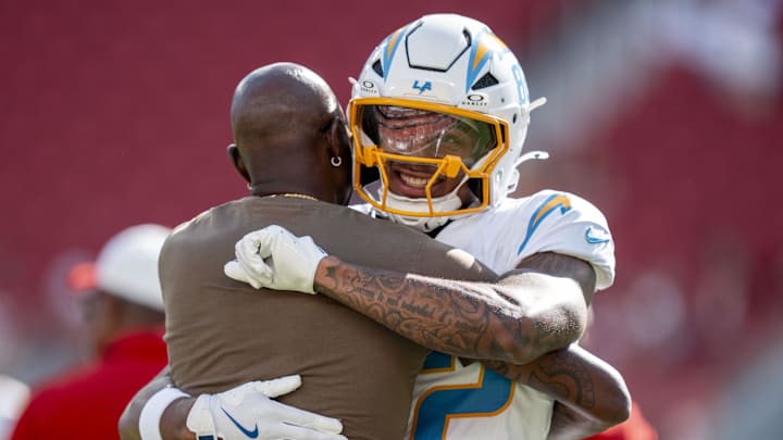August 23, 2025; Santa Clara, California, USA; Los Angeles Chargers wide receiver Brenden Rice (82) hugs father San Francisco 49ers great Jerry Rice (left) before the game at Levi's Stadium. Mandatory Credit: Kyle Terada-Imagn Images