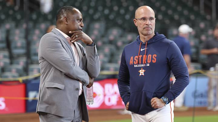 May 29, 2026; Houston, Texas, USA; Houston Astros general manager Dana Brown (left) talks with manager Joe Espada before the game against the Milwaukee Brewers at Daikin Park. Mandatory Credit: Troy Taormina-Imagn Images