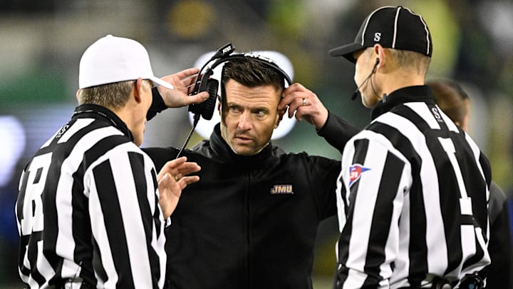 Dec 20, 2025; Eugene, OR, USA;  James Madison Dukes head coach Bob Chesney speaks with the referees during the fourth quarter against the Oregon Ducks at Autzen Stadium. Mandatory Credit: Troy Wayrynen-Imagn Images