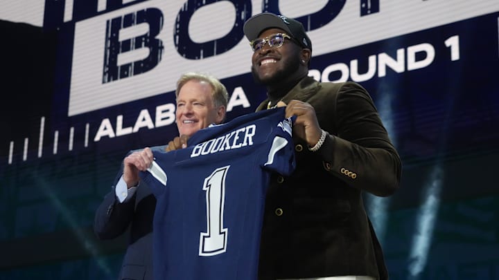 NFL commissioner Roger Goodell with Alabama Crimson Tide offensive lineman Tyler Booker after he is selected by the Dallas Cowboys as the number twelve pick in the first round of the 2025 NFL Draft at Lambeau Field. NFL commissioner Roger Goodell with Alabama Crimson Tide offensive lineman Tyler Booker after he is selected by the Dallas Cowboys as the number twelve pick in the first round of the 2025 NFL Draft at Lambeau Field.