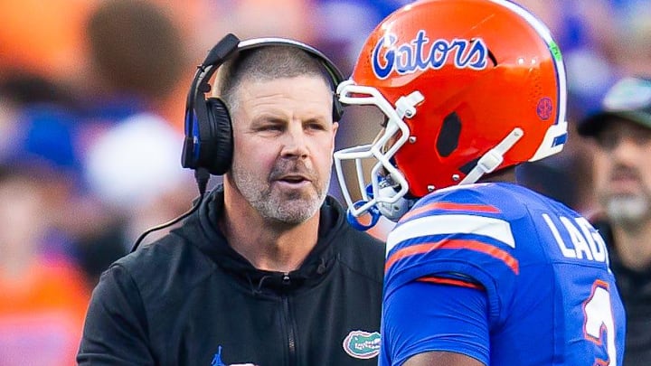 Florida Gators head coach Billy Napier talks with Florida Gators quarterback DJ Lagway (2) during the first half at Ben Hill Griffin Stadium in Gainesville, FL on Saturday, November 16, 2024. [Doug Engle/Gainesville Sun]
