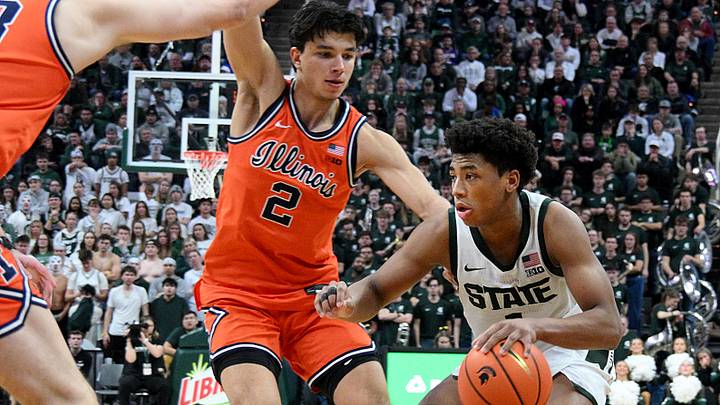 Feb 7, 2026; East Lansing, Michigan, USA;  Michigan State Spartans guard Jeremy Fears Jr. (1) drives past Illinois Fighting Illini guard Andrej Stojakovic (2) during overtime at Jack Breslin Student Events Center. Mandatory Credit: Dale Young-Imagn Images