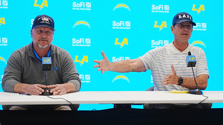 Los Angeles Chargers general manager Joe Hortiz and coach Jim Harbaugh.