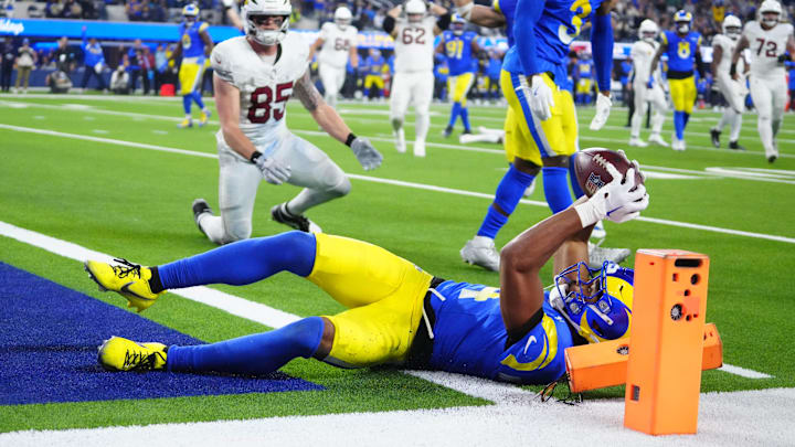 Dec 28, 2024; Inglewood, California, USA; Los Angeles Rams cornerback Ahkello Witherspoon (4) intercepts a pass with 42 seconds left against the Arizona Cardinals at SoFi Stadium. Mandatory Credit: Kirby Lee-Imagn Images