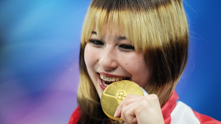 Feb 19, 2026; Milan, Italy; Alysa Liu of the United States celebrates with the gold medal in the women's free skate during the Milano Cortina 2026 Olympic Winter Games at Milano Ice Skating Arena.
