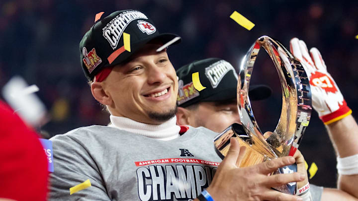 Jan 26, 2025; Kansas City, MO, USA; Kansas City Chiefs quarterback Patrick Mahomes celebrates with the Lamar Hunt Trophy after defeating the Buffalo Bills during the AFC Championship game at GEHA Field at Arrowhead Stadium. Mandatory Credit: Mark J. Rebilas-Imagn Images