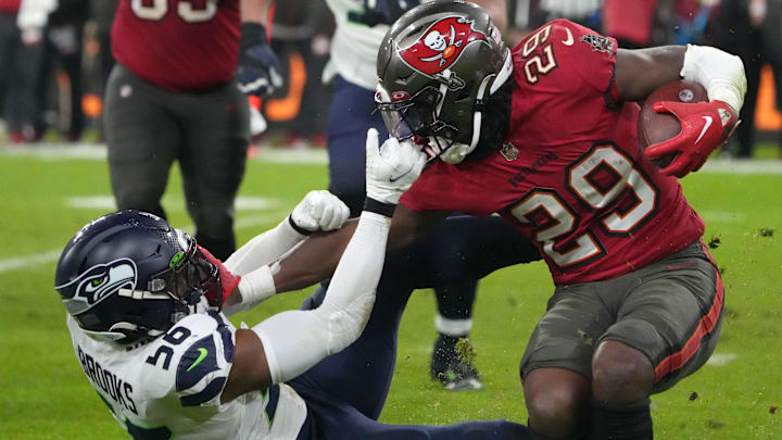 Seattle Seahawks linebacker Jordyn Brooks tackles Tampa Bay Buccaneers running back Rachaad White. Seattle Seahawks linebacker Jordyn Brooks tackles Tampa Bay Buccaneers running back Rachaad White.