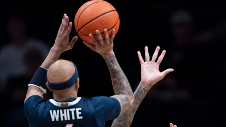 Virginia guard Jacari White (6) shoots over Vanderbilt forward Tyler Harris (8) during the second half of their exhibition game at Memorial Gym in Nashville, Tenn., Thursday, Oct. 16, 2025.
