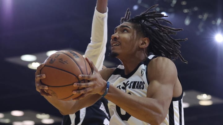 Feb 18, 2024; Indianapolis, Indiana, USA; Team Giraffe Stars forward Ron Holland (0) of the G League Ignite leaps for the net against Team BallIsLife during the G-League Next Up game at Indiana Convention Center. Mandatory Credit: Trevor Ruszkowski-USA TODAY Sports Feb 18, 2024; Indianapolis, Indiana, USA; Team Giraffe Stars forward Ron Holland (0) of the G League Ignite leaps for the net against Team BallIsLife during the G-League Next Up game at Indiana Convention Center. Mandatory Credit: Trevor Ruszkowski-USA TODAY Sports