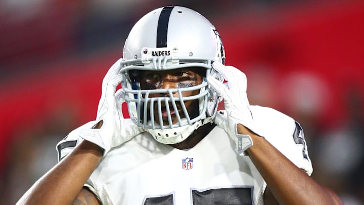 Aug 12, 2016; Glendale, AZ, USA; Oakland Raiders fullback Marcel Reece (45) against the Arizona Cardinals during a preseason game at University of Phoenix Stadium. Mandatory Credit: Mark J. Rebilas-Imagn Images