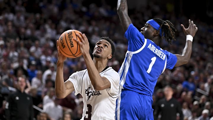 Texas A&M Aggies guard Rylan Griffen goes to the basket as Kentucky Wildcats guard Denzel Aberdeen attempts to defend during the second half at Reed Arena.