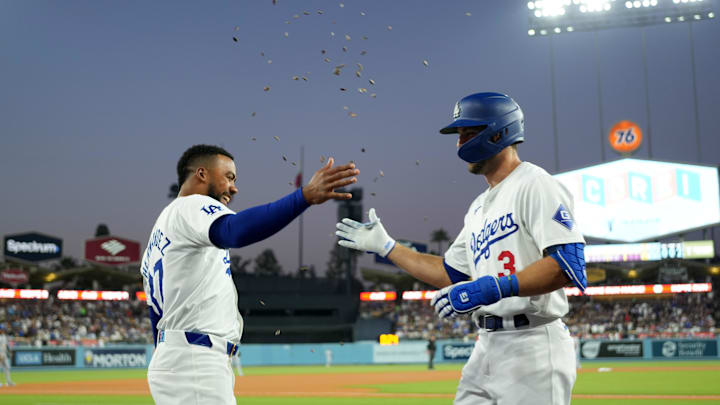 Jun 14, 2024; Los Angeles, California, USA; Los Angeles Dodgers left fielder Chris Taylor (3) is congratulated by right fielder Teoscar Hernandez (37) after hitting a two-run home run in the fifth inning against the Kansas City Royals at Dodger Stadium. Mandatory Credit: Kirby Lee-USA TODAY Sports