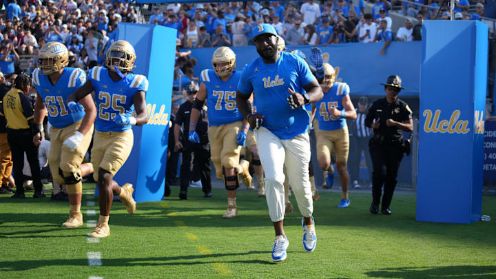 Sep 14, 2024; Pasadena, California, USA; UCLA Bruins head coach DeShaun Foster enters the field before the game against the Indiana Hoosiers at Rose Bowl. Mandatory Credit: Kirby Lee-Imagn Images Sep 14, 2024; Pasadena, California, USA; UCLA Bruins head coach DeShaun Foster enters the field before the game against the Indiana Hoosiers at Rose Bowl. Mandatory Credit: Kirby Lee-Imagn Images