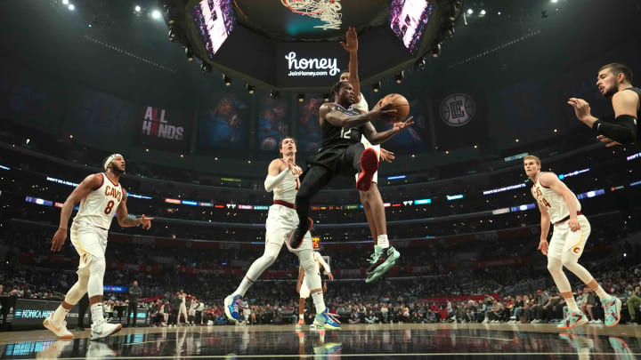 Oct 27, 2021; Los Angeles, California, USA; LA Clippers guard Eric Bledsoe (12) passes the ball against the Cleveland Cavaliers in the first half at Staples Center. Mandatory Credit: Kirby Lee-USA TODAY Sports