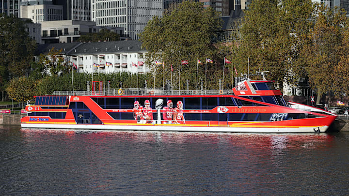 Nov 4, 2023; Frankfurt, Germany;  The Kansas City Chiefs ChampionShip boat with images of Kansas City Chiefs linebacker Nick Bolton (32), quarterback Patrick Mahomes (15), defensive tackle Chris Jones (95) and tight end Travis Kelce (87) and Super Bowl 57 Lombardi Trophy on the bank of the Main River. Mandatory Credit: Kirby Lee-Imagn Images