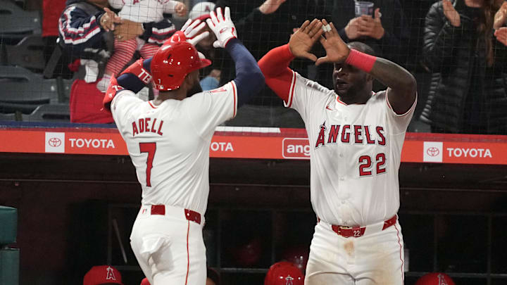 Apr 22, 2024; Anaheim, California, USA; Los Angeles Angels right fielder Jo Adell (7) celebrates with third baseman Miguel Sano (22) after hitting a solo home run in the seventh inning against the Baltimore Orioles at Angel Stadium. Mandatory Credit: Kirby Lee-USA TODAY Sports
