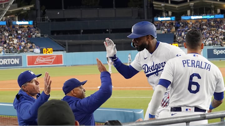 Apr 4, 2023; Los Angeles, California, USA; Los Angeles Dodgers right fielder Jason Heyward (23) is congratulated by manager Dave Roberts (center) and bench coach Bob Geren after hitting a home run in the third inning against the Colorado Rockies at Dodger Stadium. Mandatory Credit: Kirby Lee-Imagn Images Apr 4, 2023; Los Angeles, California, USA; Los Angeles Dodgers right fielder Jason Heyward (23) is congratulated by manager Dave Roberts (center) and bench coach Bob Geren after hitting a home run in the third inning against the Colorado Rockies at Dodger Stadium. Mandatory Credit: Kirby Lee-Imagn Images