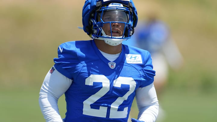 May 21, 2024, Thousand Oaks, California, USA; Los Angeles Rams running back Blake Corum (22) wears a Guardian helmet cap during organized team activities at Cal Lutheran University. Mandatory Credit: Kirby Lee-USA TODAY Sports