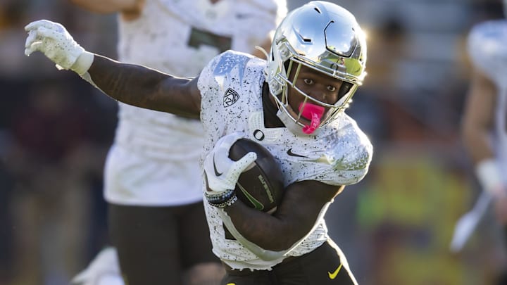 Nov 18, 2023; Tempe, Arizona, USA; Oregon Ducks running back Bucky Irving (0) runs the ball against