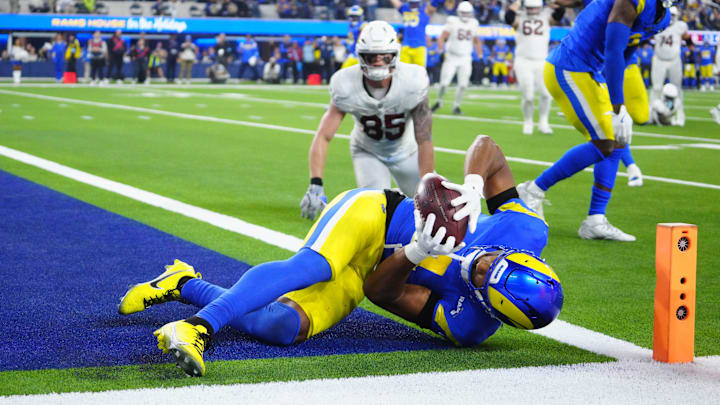 Dec 28, 2024; Inglewood, California, USA; Los Angeles Rams cornerback Ahkello Witherspoon (4) intercepts a pass with 42 seconds left against the Arizona Cardinals at SoFi Stadium. Mandatory Credit: Kirby Lee-Imagn Images