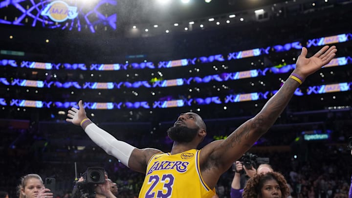 Jan 23, 2025; Los Angeles, California, USA; Los Angeles Lakers forward LeBron James (23) throws powdered chalk into the air before the game against the Boston Celtics at the Crypto.com Arena. Mandatory Credit: Kirby Lee-Imagn Images