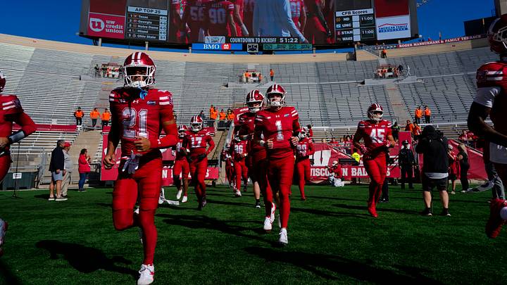 Oct 3, 2026; Madison, Wisconsin, USA;  Wisconsin Badgers players run onto the field for warmups prior to the game against the Michigan State Spartans at Camp Randall Stadium. Mandatory Credit: Jeff Hanisch-Imagn Images