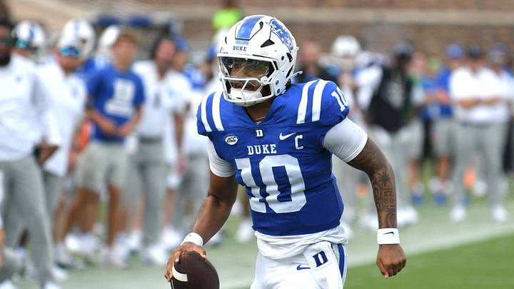 Sep 6, 2025; Durham, North Carolina, USA;  Duke Blue Devils quarterback Darian Mensah (10) runs against the Illinois Fighting Illini during the third quarter at Wallace Wade Stadium. Mandatory Credit: Zachary Taft-Imagn Images