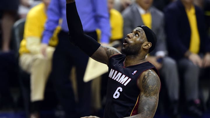 May 20, 2014; Indianapolis, IN, USA; Miami Heat forward LeBron James (6) lays up the ball which was then dunked by Miami Heat guard Dwyane Wade (not pictured) during the second half of game two of the Eastern Conference Finals of the 2014 NBA Playoffs at Bankers Life Fieldhouse. The Miami Heat beat the Indiana Pacers 87 to 83.  Mandatory Credit: Marc Lebryk-Imagn Images