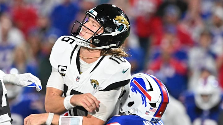Sep 23, 2024; Orchard Park, New York, USA; Jacksonville Jaguars quarterback Trevor Lawrence (16) is hit by Buffalo Bills linebacker Von Miller (40) in the fourth quarter at Highmark Stadium. Mandatory Credit: Mark Konezny-Imagn Images