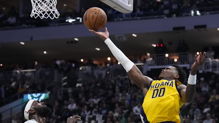 Apr 25, 2025; Milwaukee, Wisconsin, USA; Indiana Pacers guard Bennedict Mathurin (00) puts up a shot against Milwaukee Bucks forward Bobby Portis (9) in the first half during game three of first round for the 2024 NBA Playoffs at Fiserv Forum. Mandatory Credit: Michael McLoone-Imagn Images Apr 25, 2025; Milwaukee, Wisconsin, USA; Indiana Pacers guard Bennedict Mathurin (00) puts up a shot against Milwaukee Bucks forward Bobby Portis (9) in the first half during game three of first round for the 2024 NBA Playoffs at Fiserv Forum. Mandatory Credit: Michael McLoone-Imagn Images