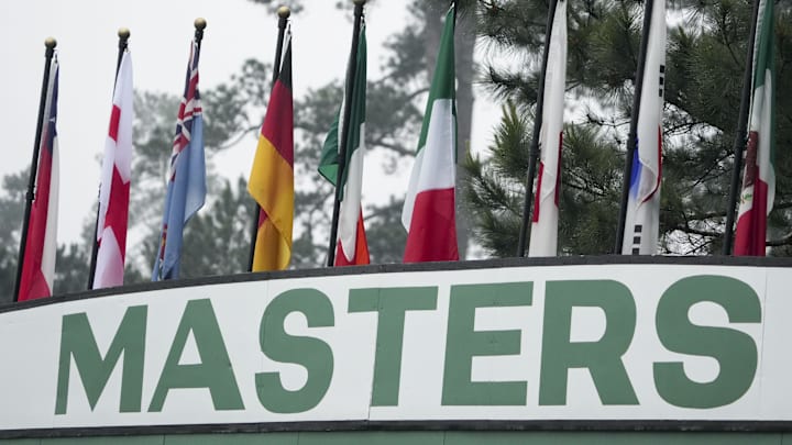 Flags rise from The Masters leaderboard at Augusta National Golf Club Flags rise from The Masters leaderboard at Augusta National Golf Club