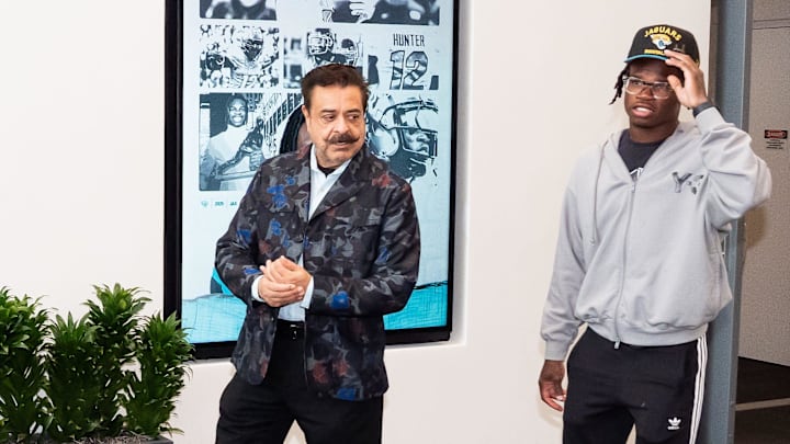 The Jacksonville Jaguars first-round pick, Colorado Buffaloes wide receiver and defensive back Travis Hunter, right, was greeted by Jaguars owner Shahid Khan, left, after Hunter arrived on Friday, March 25, 2025 at Miller Electric Center in Jacksonville, Fla. The team traded up from fifth to second after making a deal with the Cleveland Browns on Thursday night. [Doug Engle/Florida Times-Union]
