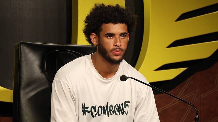 Oregon Ducks Quarterback Dante Moore speaks with reporters at the Hatfield-Dowlin Complex in Eugene. Oregon Ducks Quarterback Dante Moore speaks with reporters at the Hatfield-Dowlin Complex in Eugene.