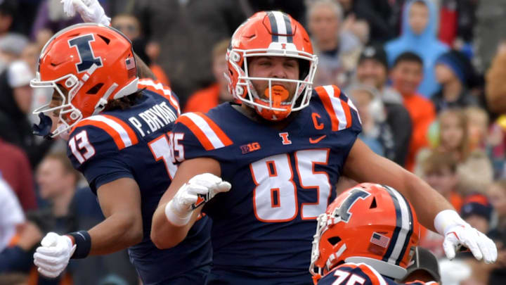 Nov 16, 2024; Champaign, Illinois, USA; Illinois Fighting Illini offensive lineman Brandon Henderson (75) and tight end Tanner Arkin (85) celebrate wide receiver Pat Bryant (13) scoring a touchdown against the Michigan State Spartans during the first half at Memorial Stadium. Mandatory Credit: Ron Johnson-Imagn Images Nov 16, 2024; Champaign, Illinois, USA; Illinois Fighting Illini offensive lineman Brandon Henderson (75) and tight end Tanner Arkin (85) celebrate wide receiver Pat Bryant (13) scoring a touchdown against the Michigan State Spartans during the first half at Memorial Stadium. Mandatory Credit: Ron Johnson-Imagn Images