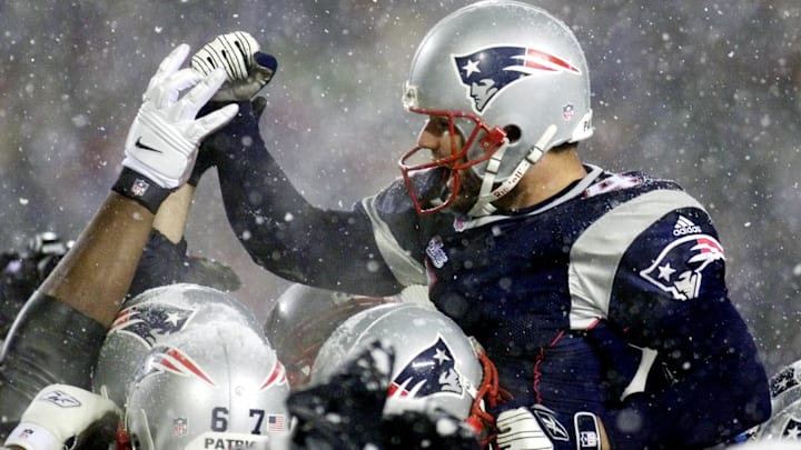 Field kicker Adam Vinatieri (L) of the New England